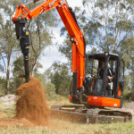 auger drive and bit on mini excavator