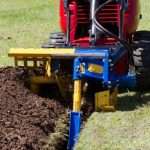 mini skid steer trencher digging trench