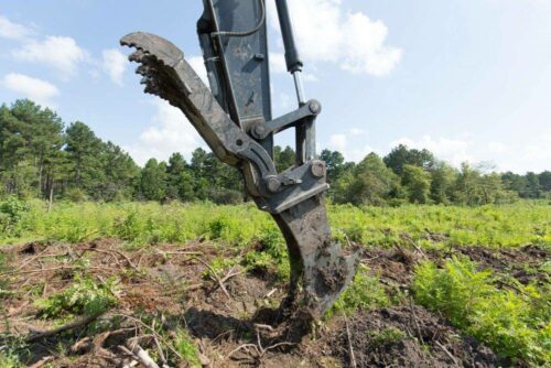 Stump puller and thumb on excavator