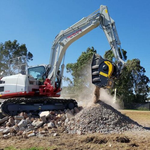 MB Crusher Bucket crushing material on a Takeuchi TB2150 Excavator